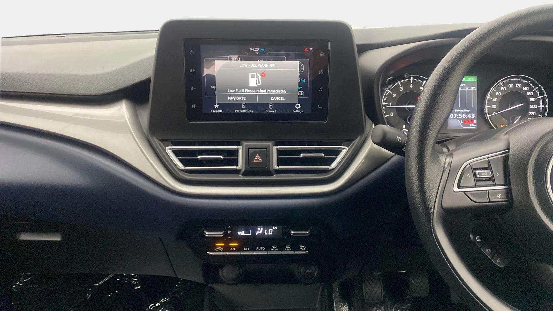 Dashboard and steering wheel of a Maruti Suzuki Baleno
