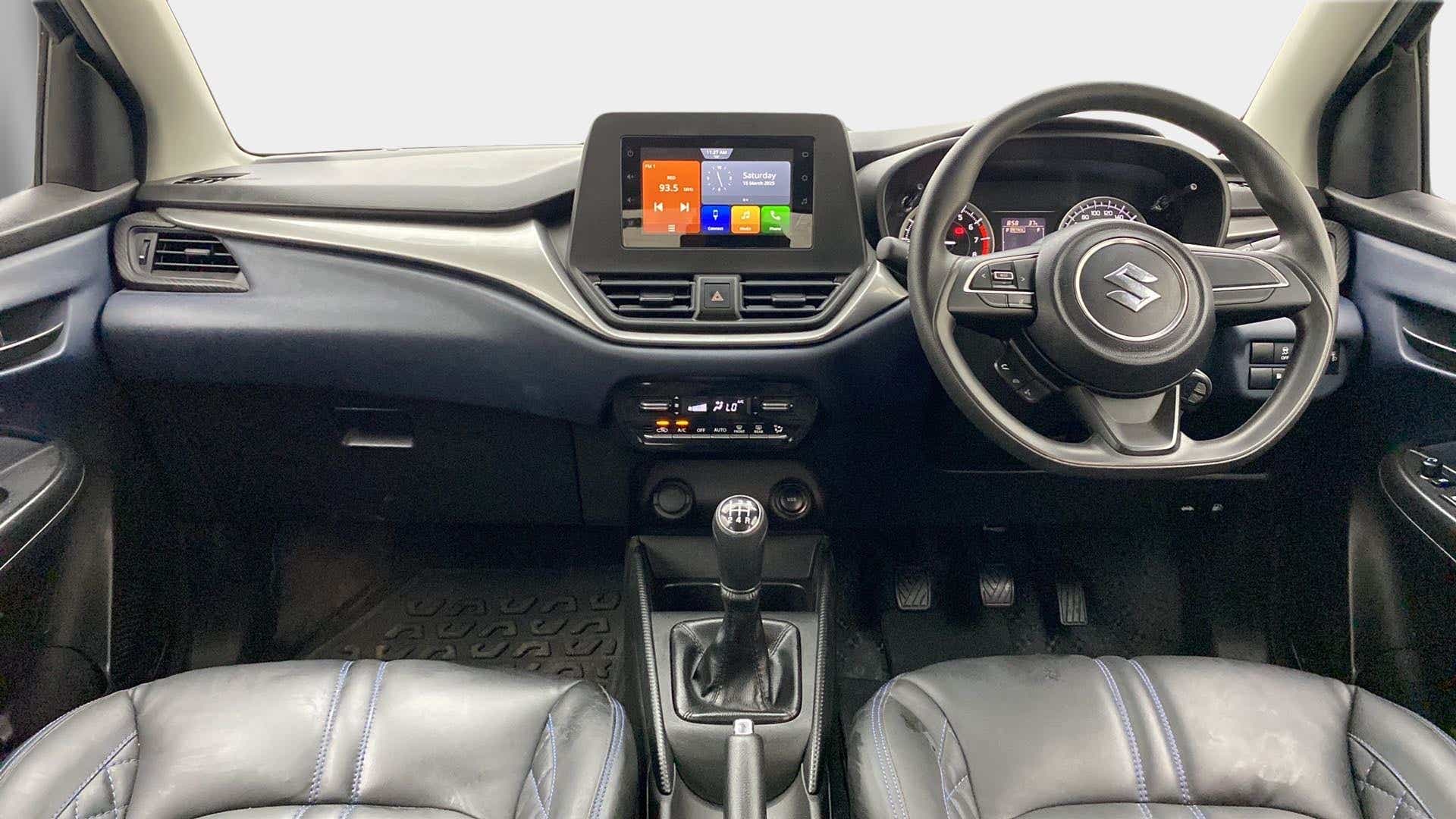 Dashboard and steering wheel of a Maruti Suzuki Baleno