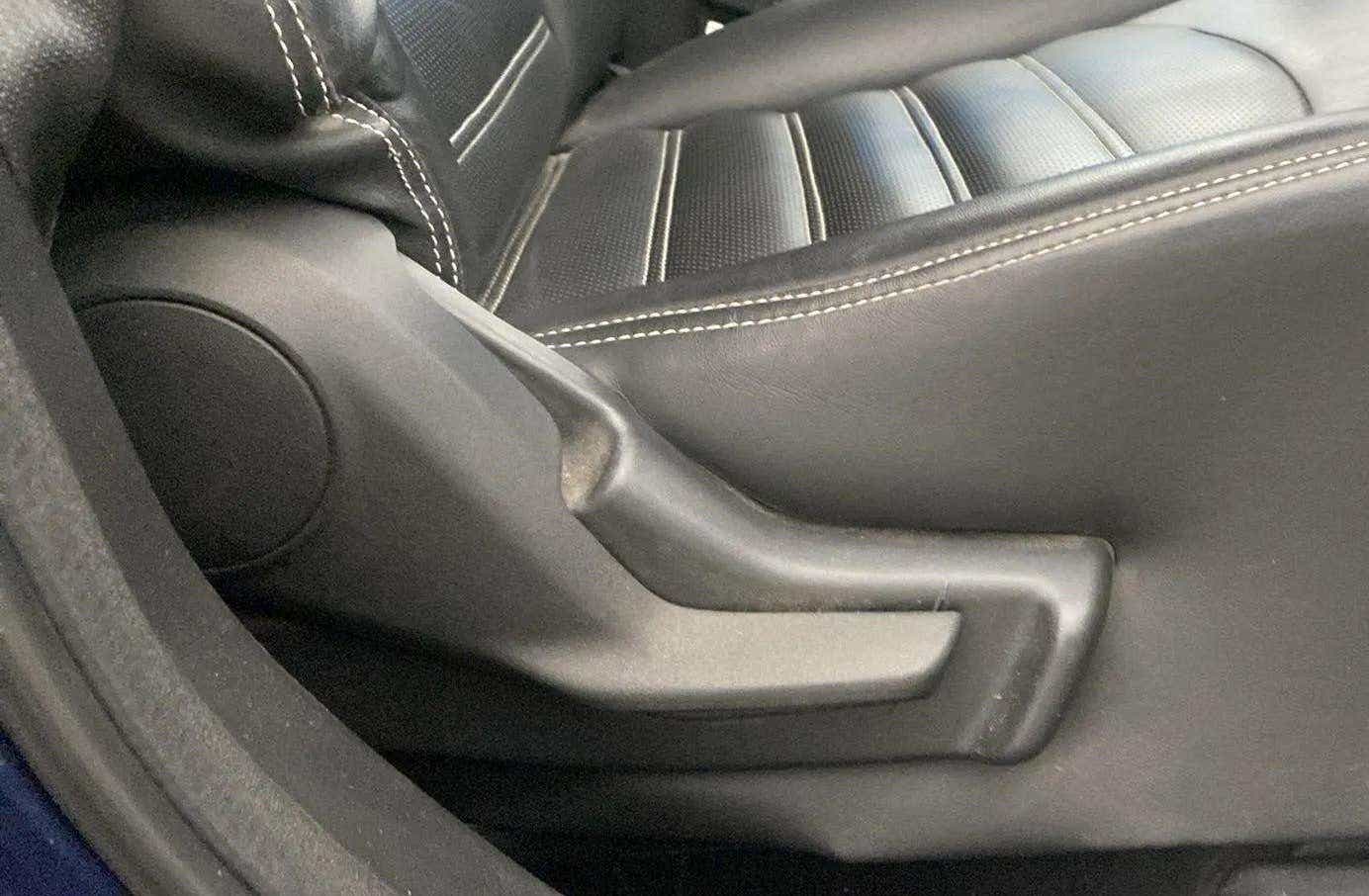Close-up of a seat adjuster and stitching on a Maruti Suzuki Baleno