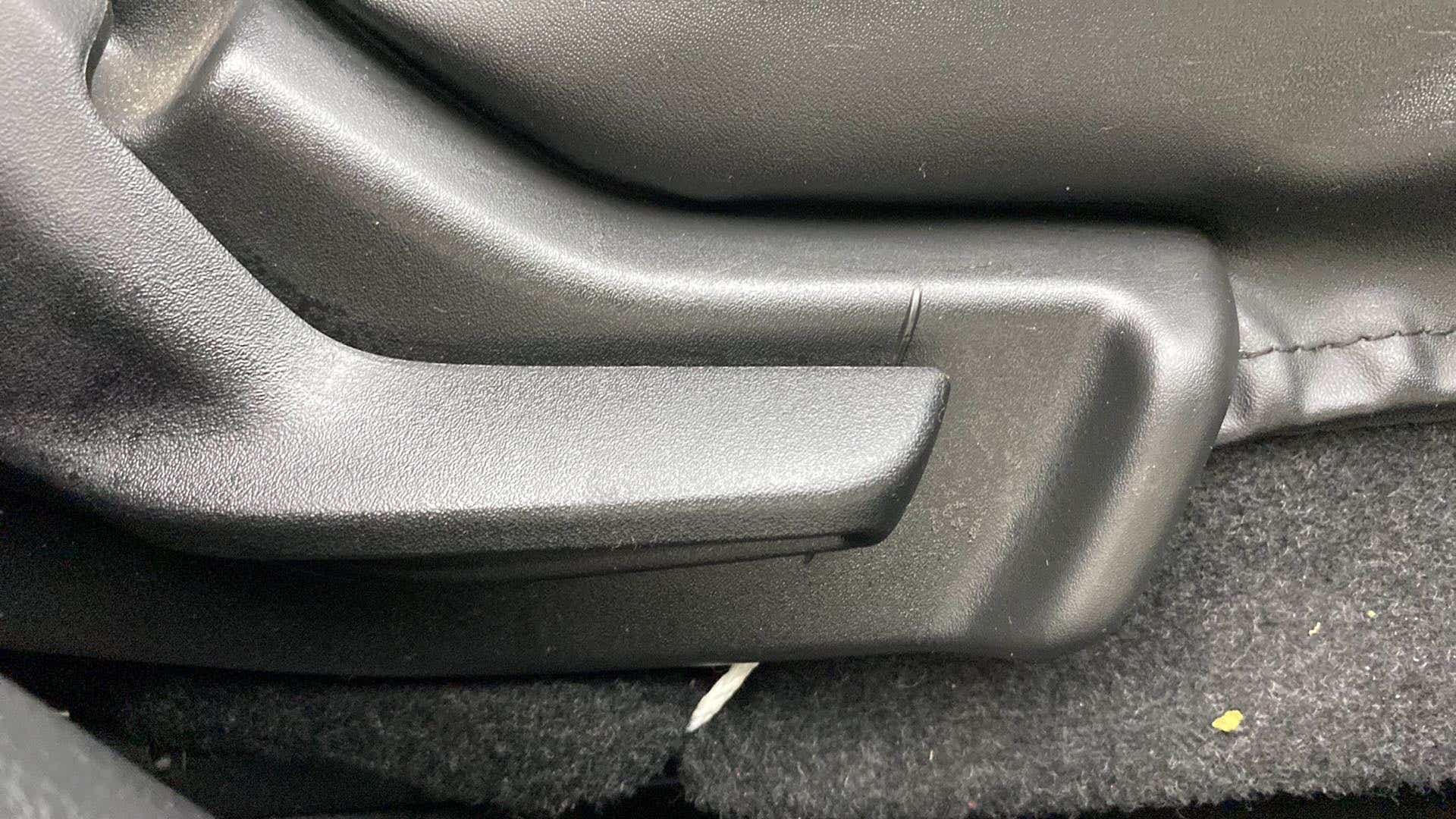Close-up of a car seat adjuster lever of a Maruti Suzuki Baleno