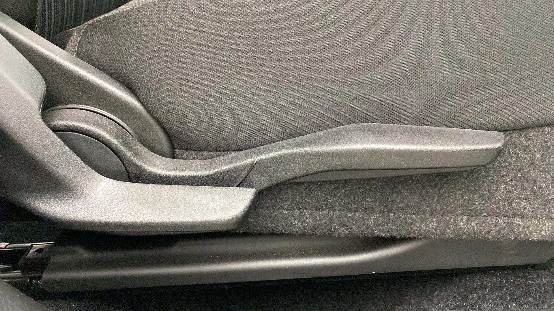 Seat height adjustment lever of a Maruti Suzuki Baleno