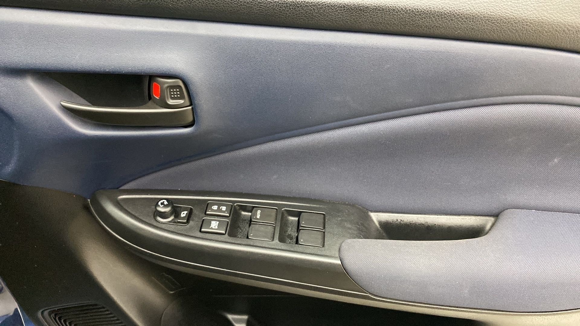 Interior driver side door panel of a Maruti Suzuki Baleno