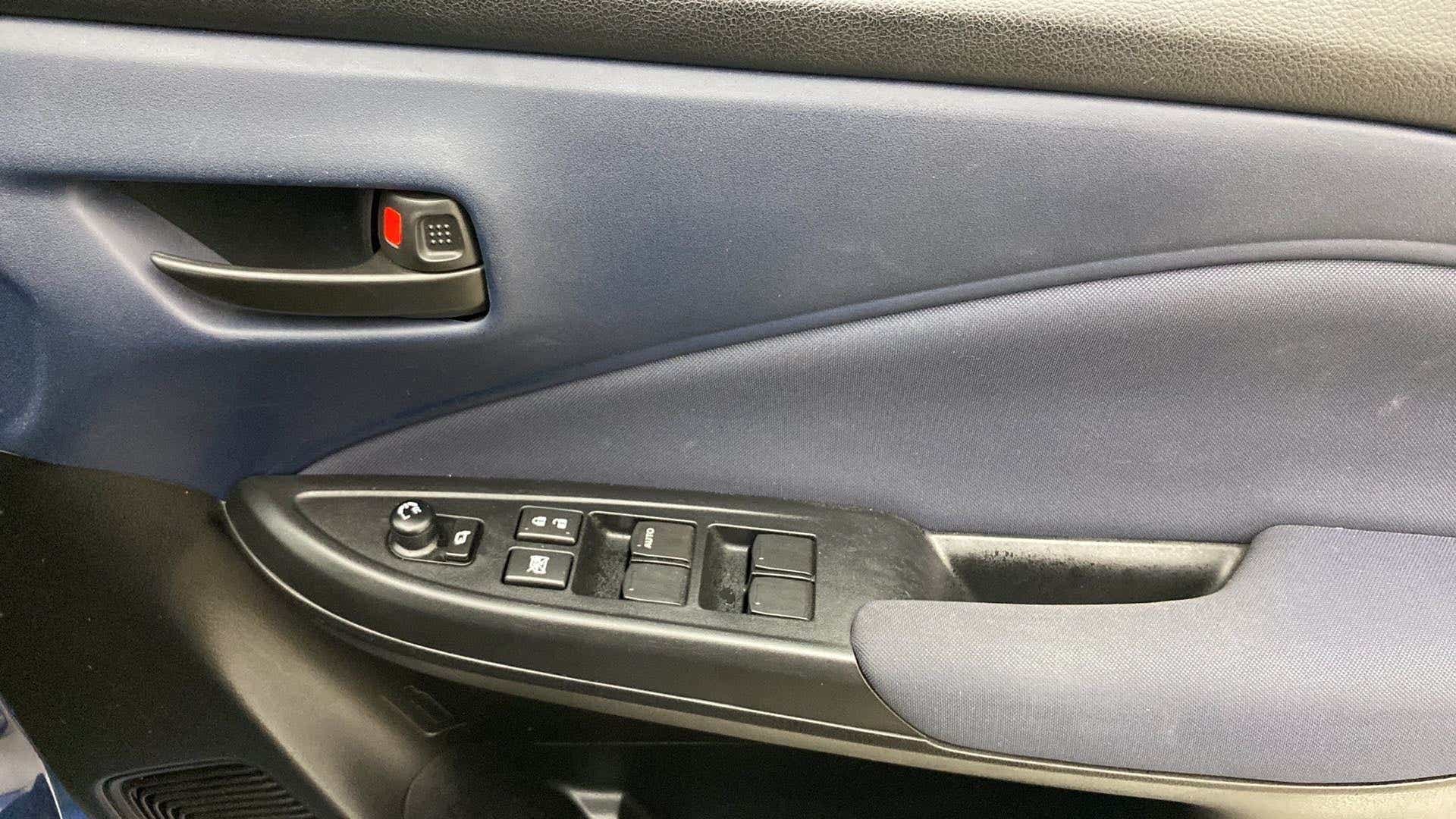 Interior driver side door panel of a Maruti Suzuki Baleno