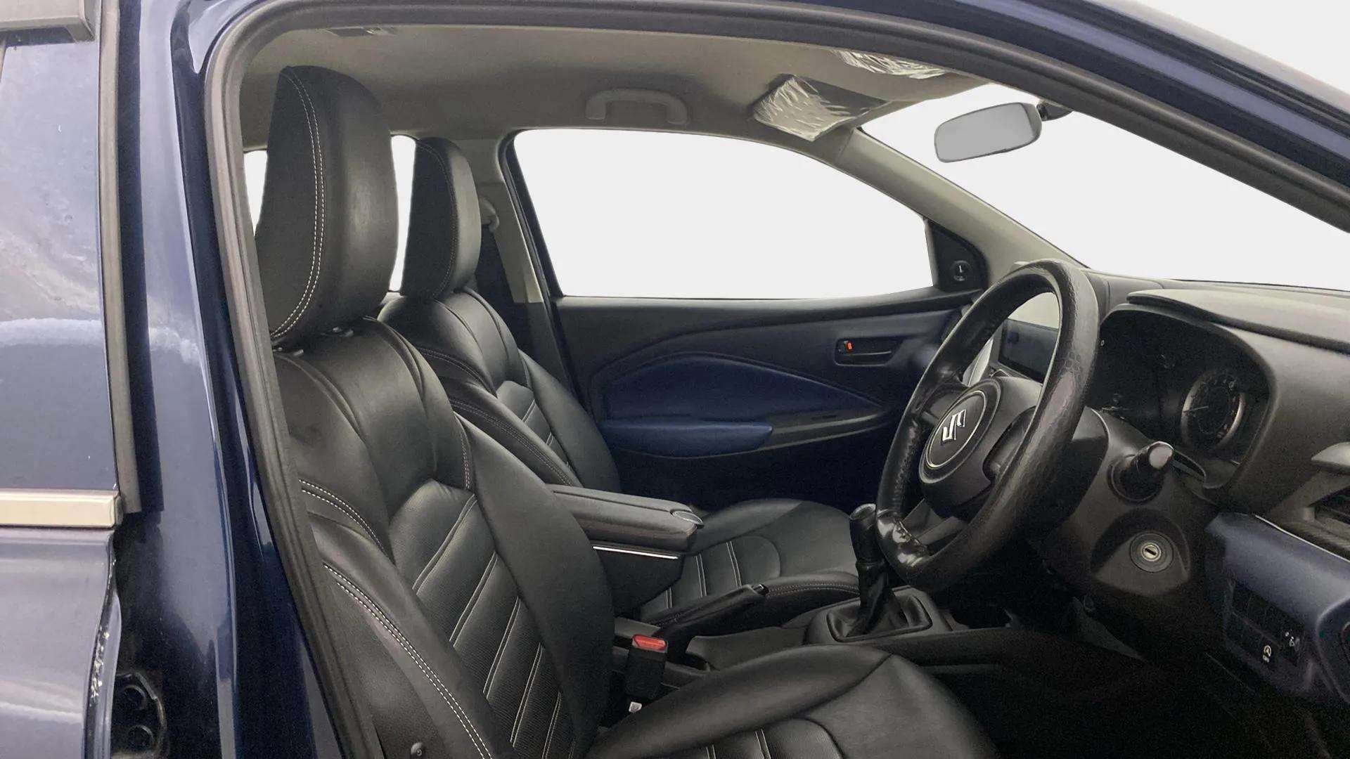 Front interior view of a Maruti Suzuki Baleno.
