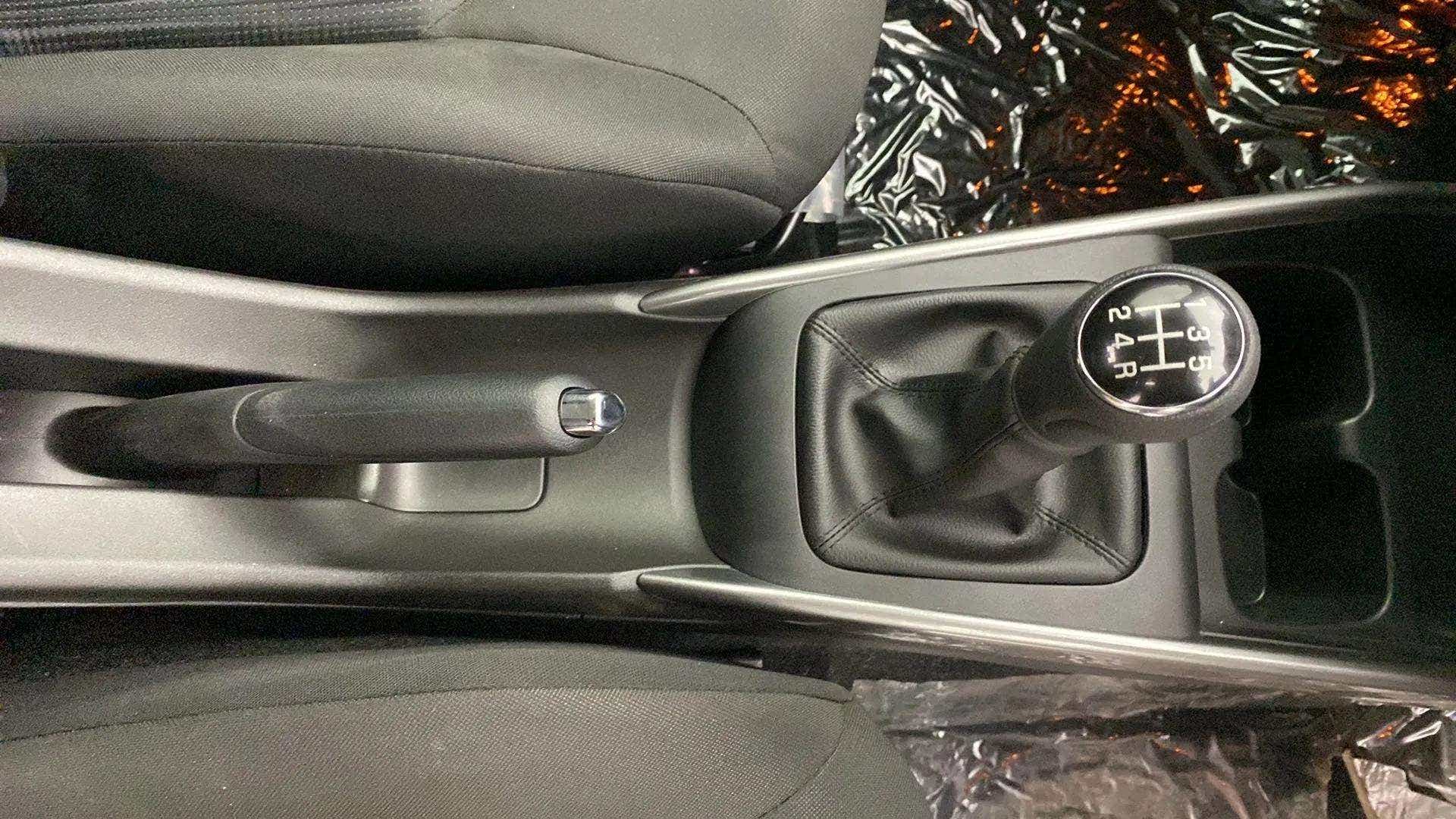 Gear shift and handbrake view of a Maruti Suzuki Baleno