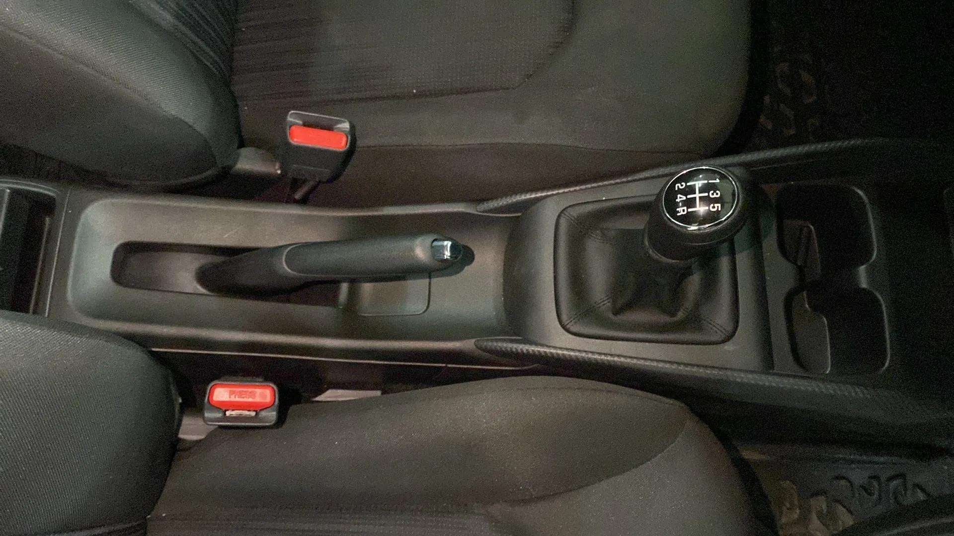 Center console with gear lever and handbrake of a Maruti Suzuki Baleno