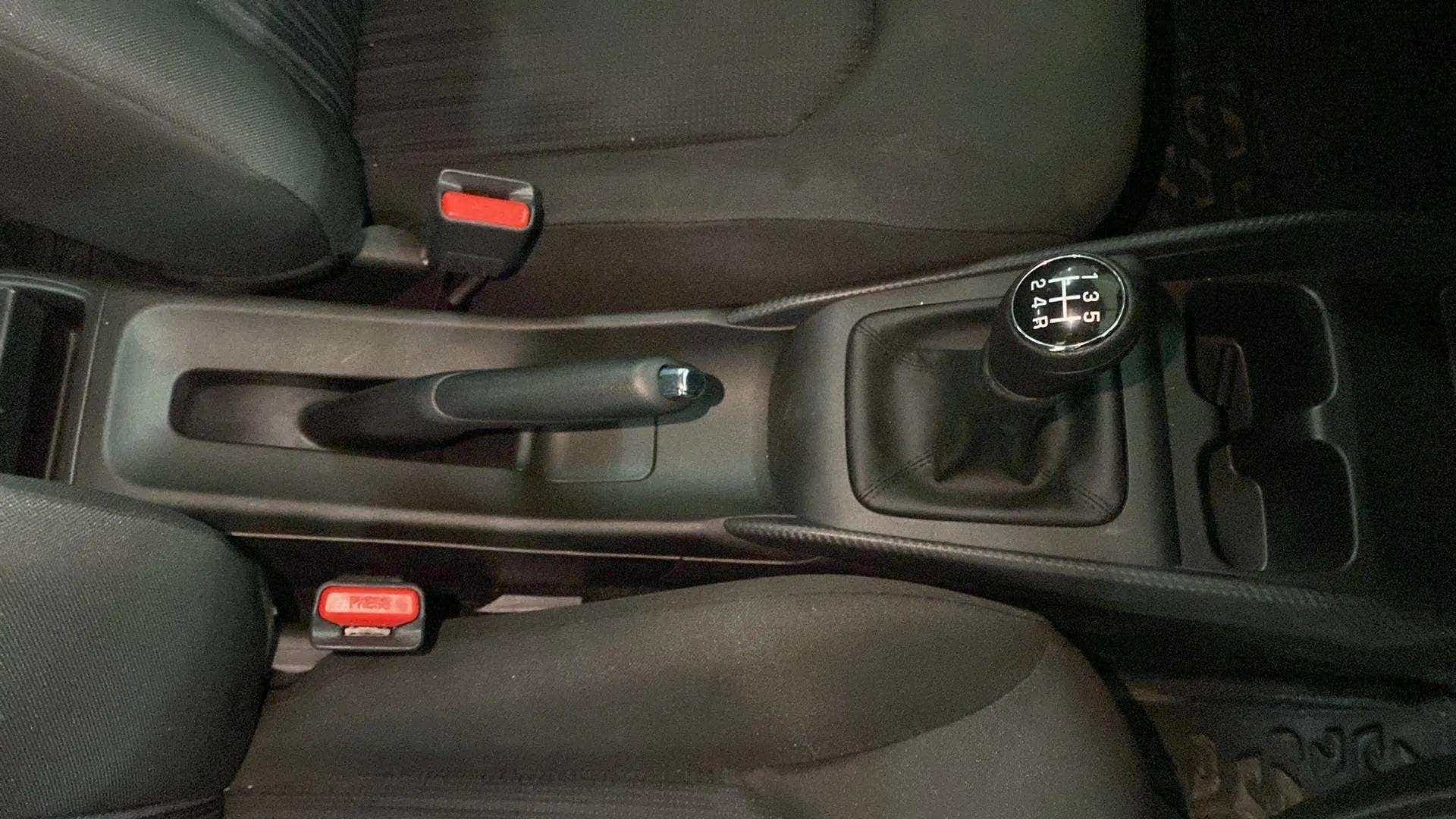 Center console with gear lever and handbrake of a Maruti Suzuki Baleno