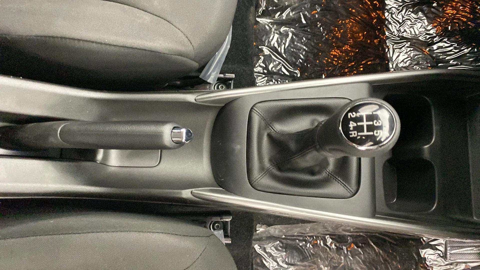 Gear shift and handbrake view of a Maruti Suzuki Baleno