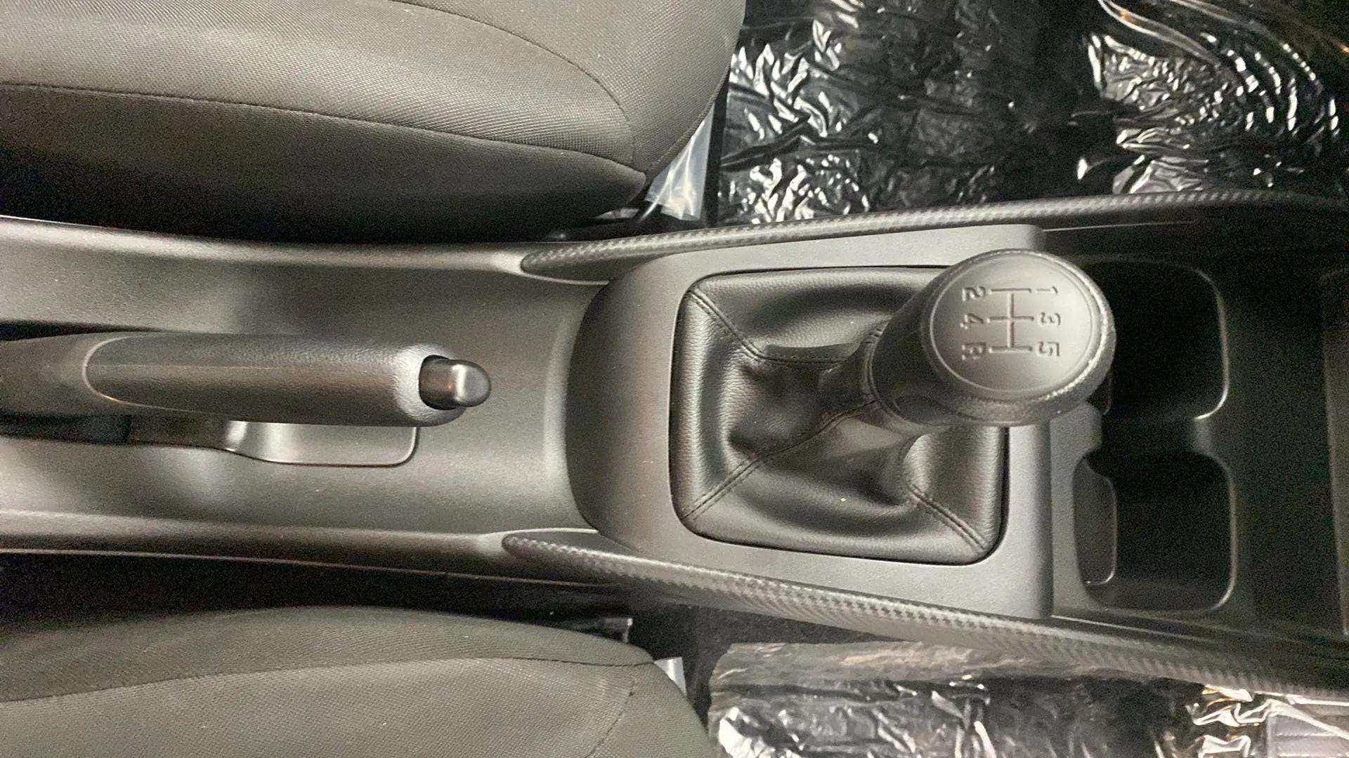 Gear lever and handbrake area of a Maruti Suzuki Baleno