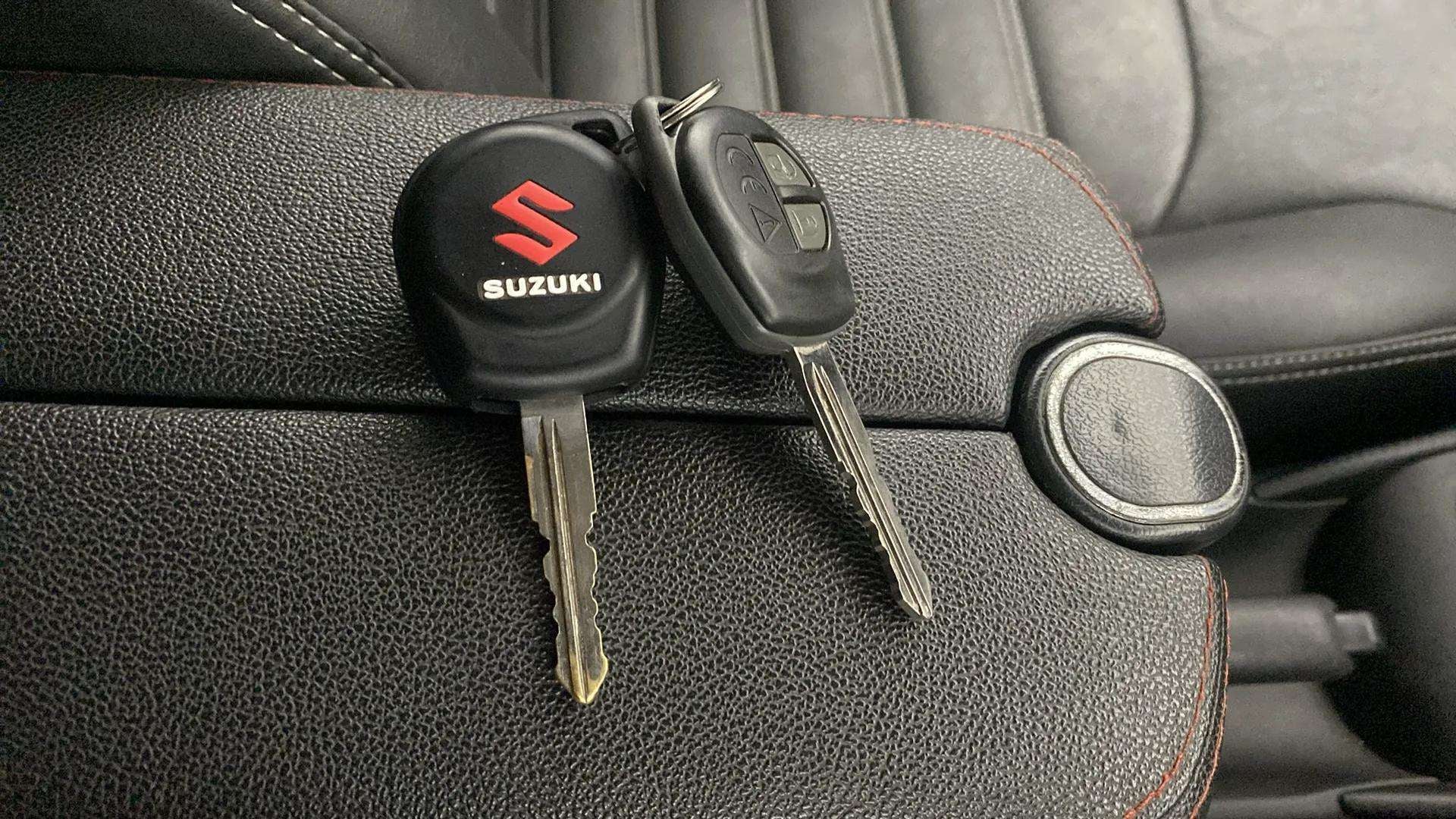 Close-up of car keys on the center console of a Maruti Suzuki Baleno