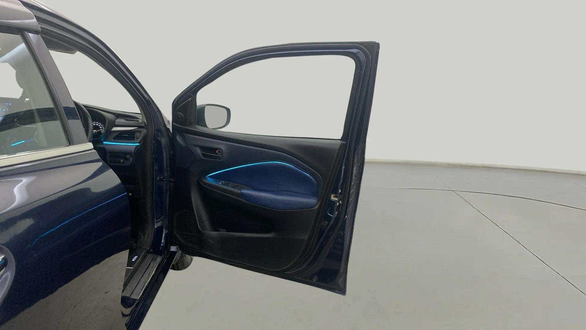 Driver side door and dashboard view of a Maruti Suzuki Baleno