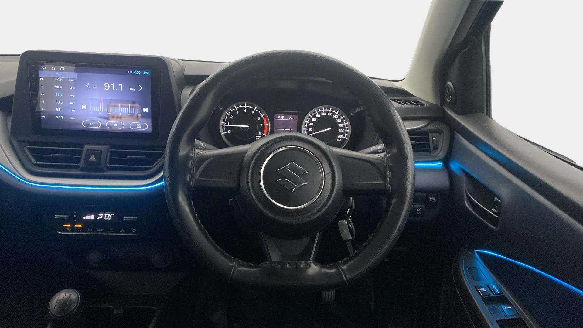Dashboard and steering wheel view of a Maruti Suzuki Baleno