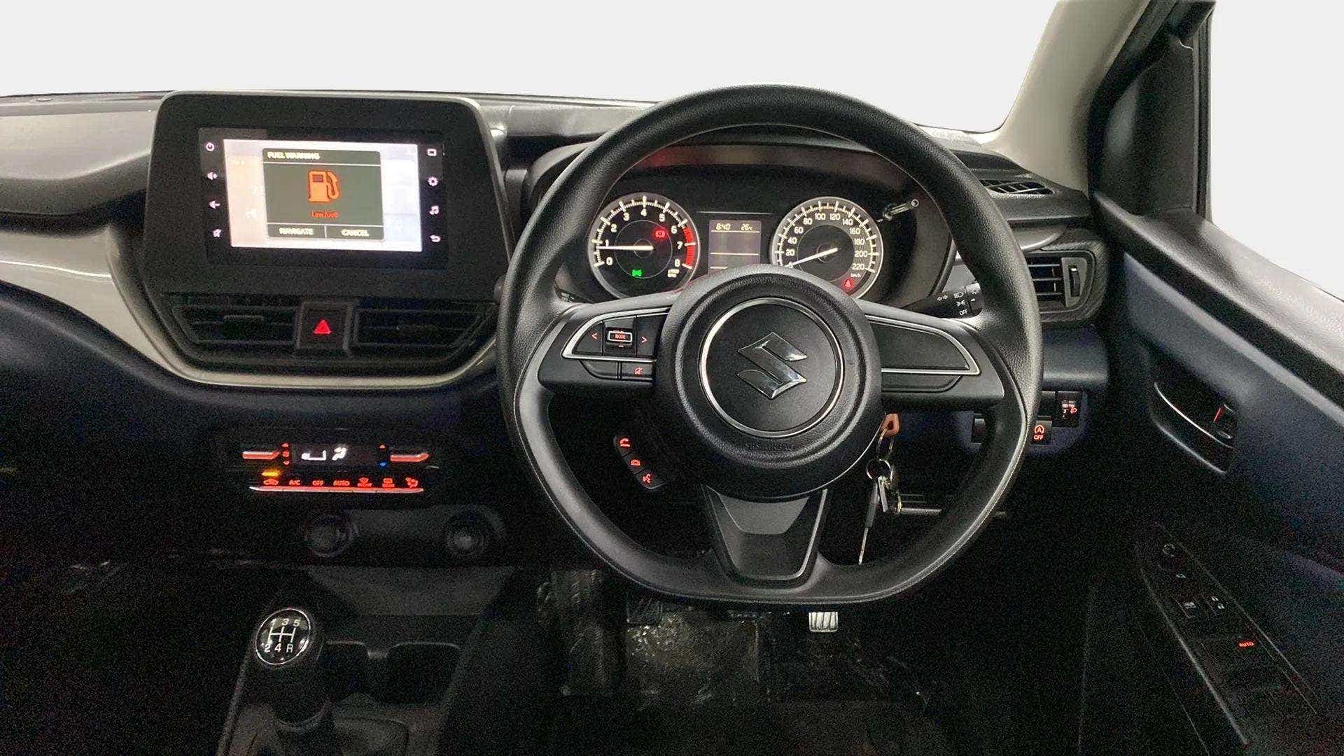Dashboard and steering wheel of a Maruti Suzuki Baleno