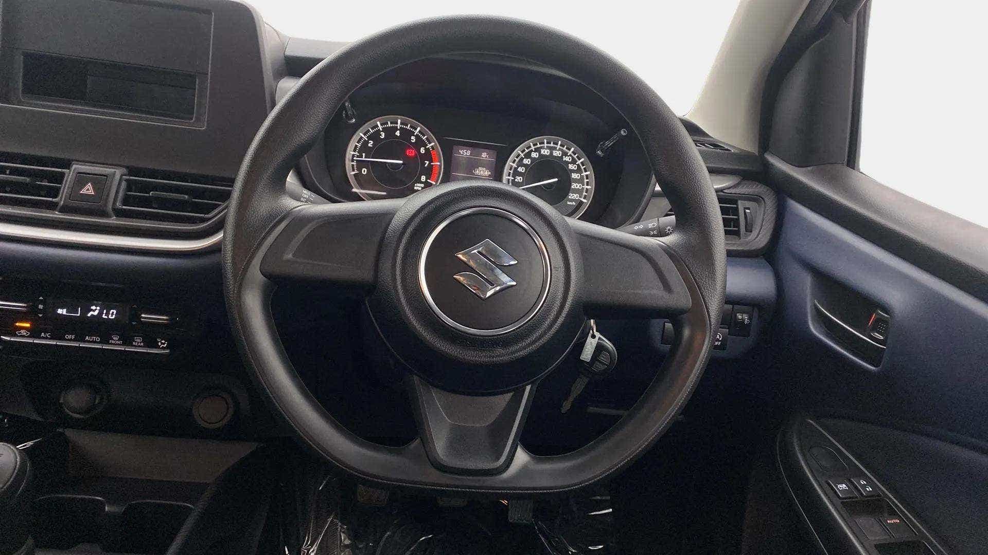 Steering wheel and dashboard view of a Maruti Suzuki Baleno