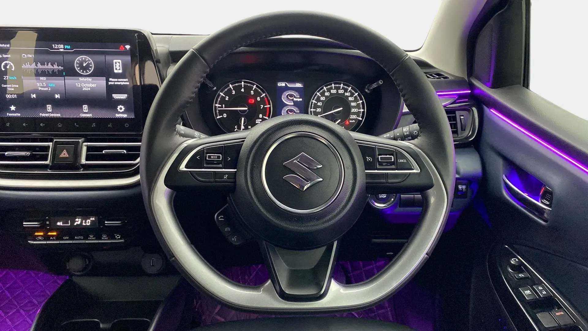 Interior dashboard and steering wheel of a Maruti Suzuki Baleno