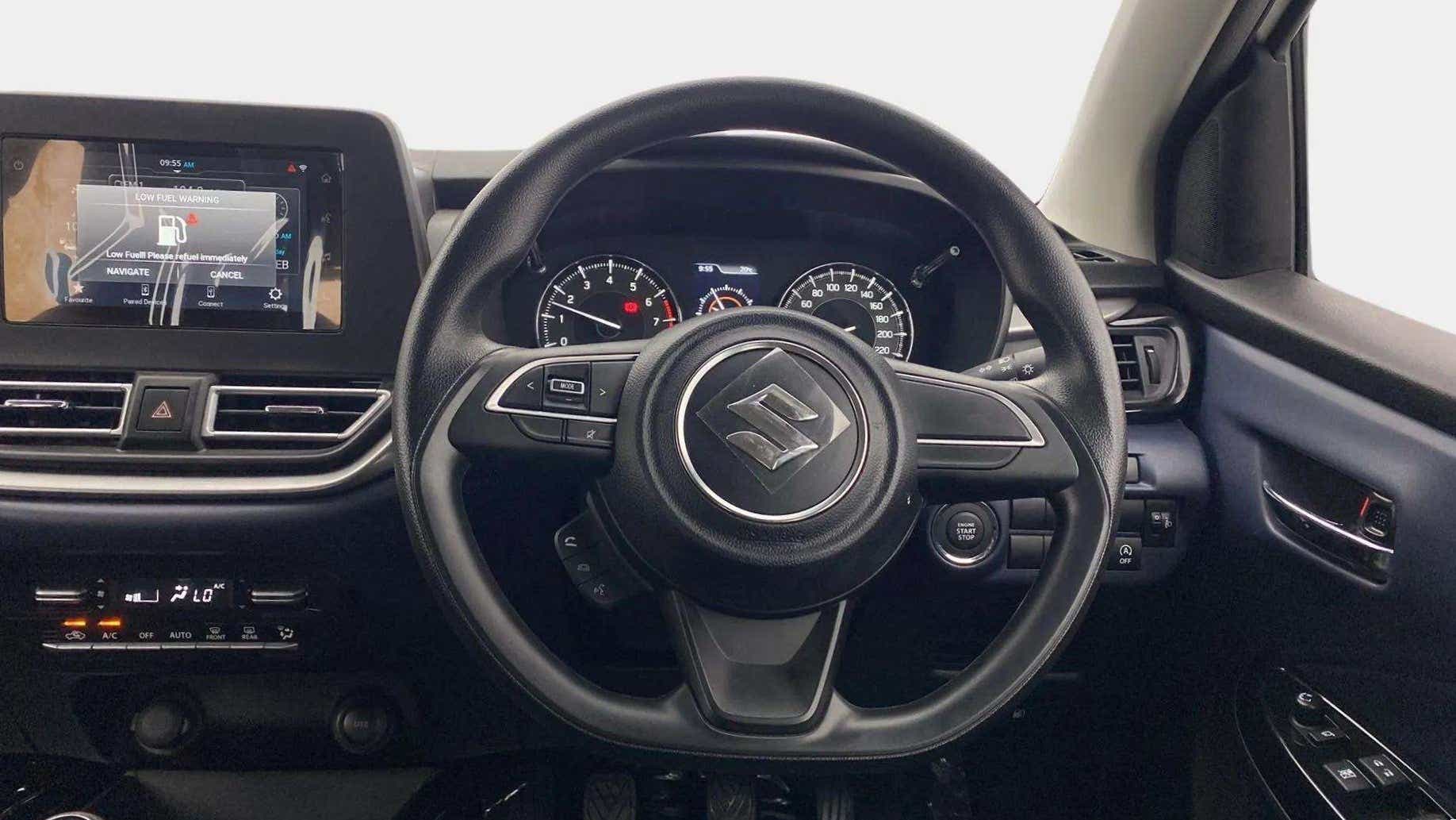 Interior dashboard and steering wheel of a Maruti Suzuki Baleno
