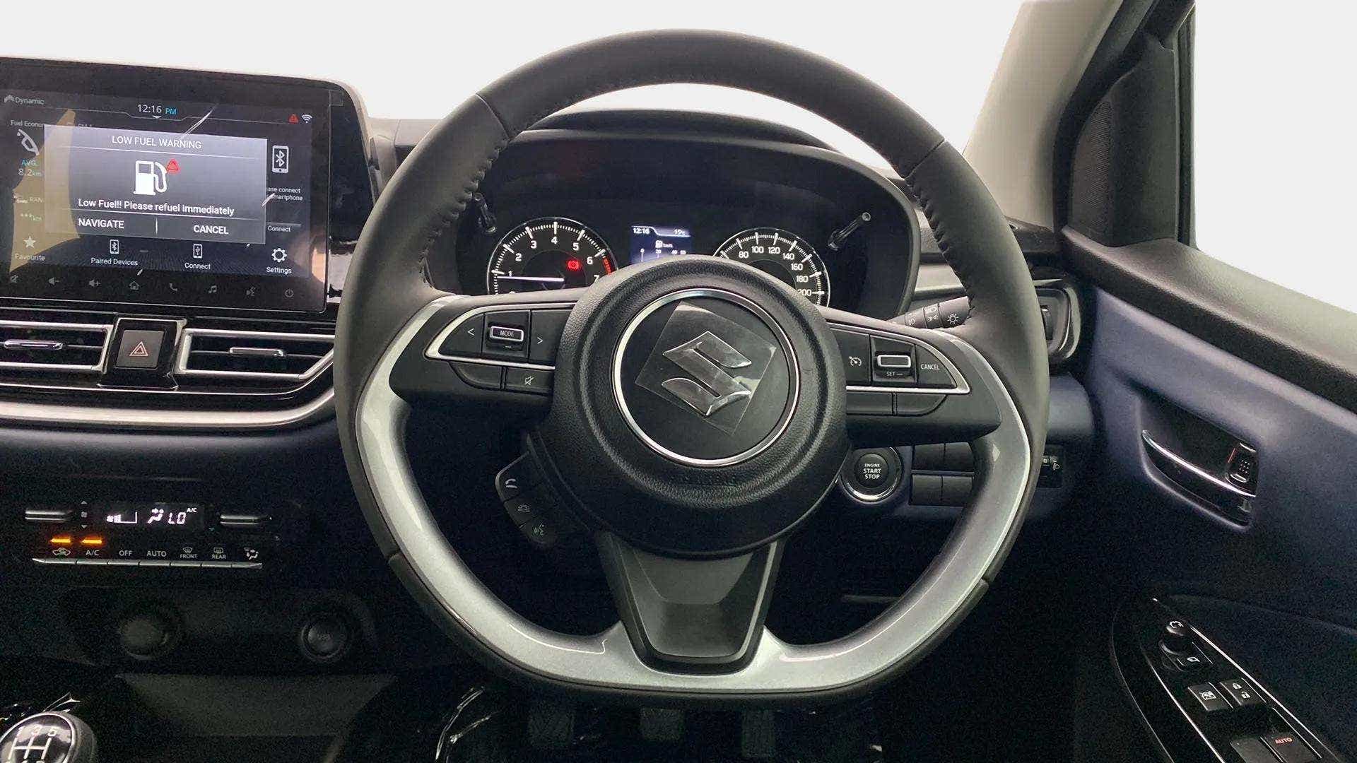 Steering wheel and dashboard of a Maruti Suzuki Baleno