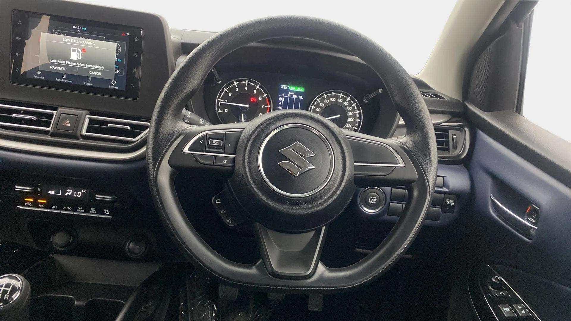Interior dashboard and steering wheel of a Maruti Suzuki Baleno