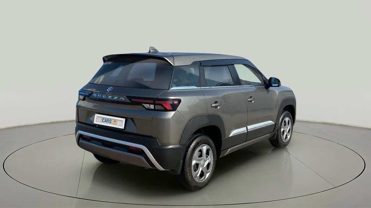 Rear three-quarter of a Magma Grey Maruti Suzuki Brezza