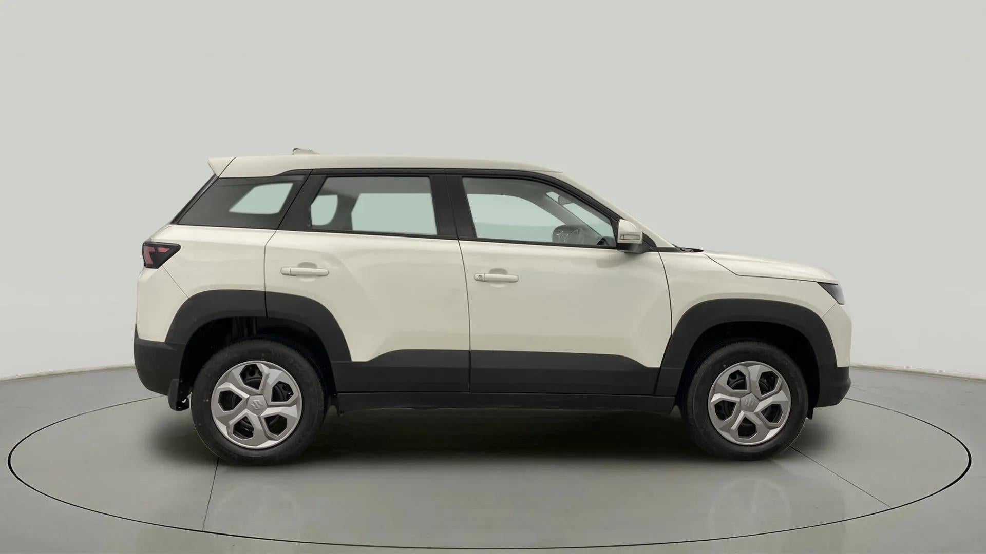 Side view of a Pearl Arctic White Maruti Suzuki Brezza