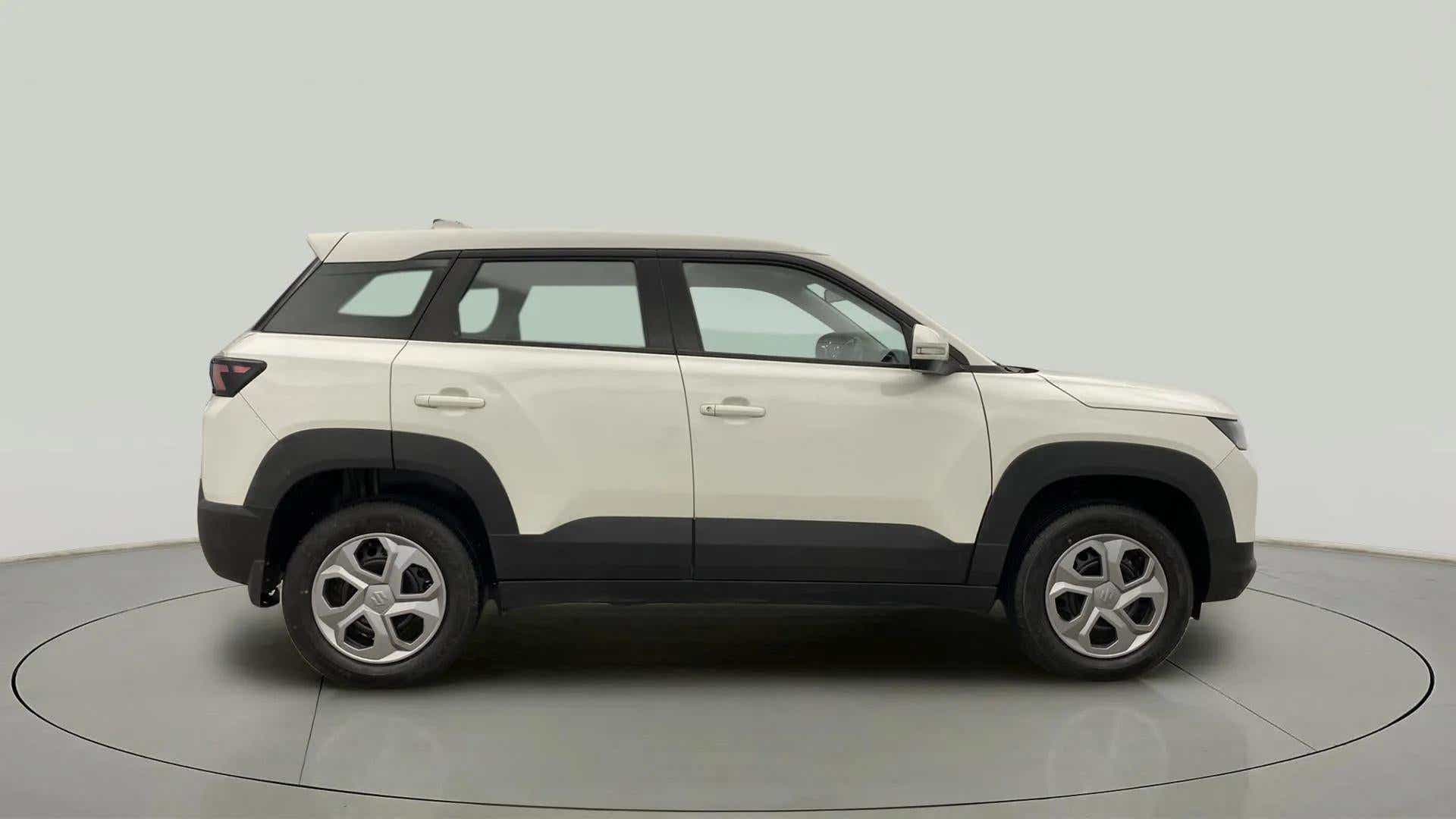 Side view of a Pearl Arctic White Maruti Suzuki Brezza