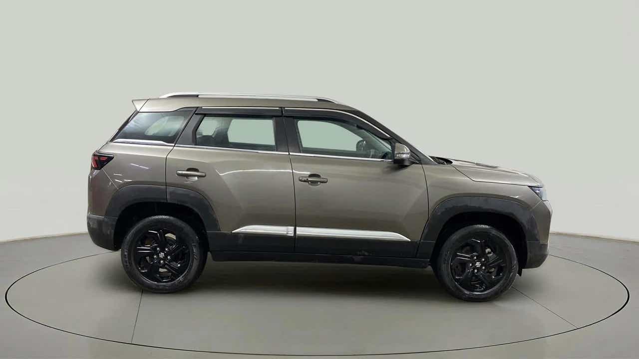Side view of a Magma Grey Maruti Suzuki Brezza
