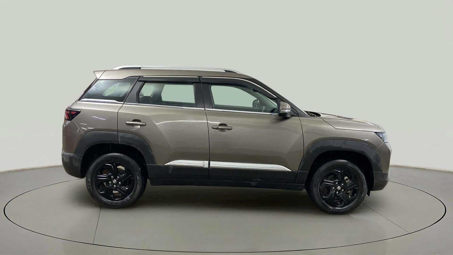 Side view of a Magma Grey Maruti Suzuki Brezza