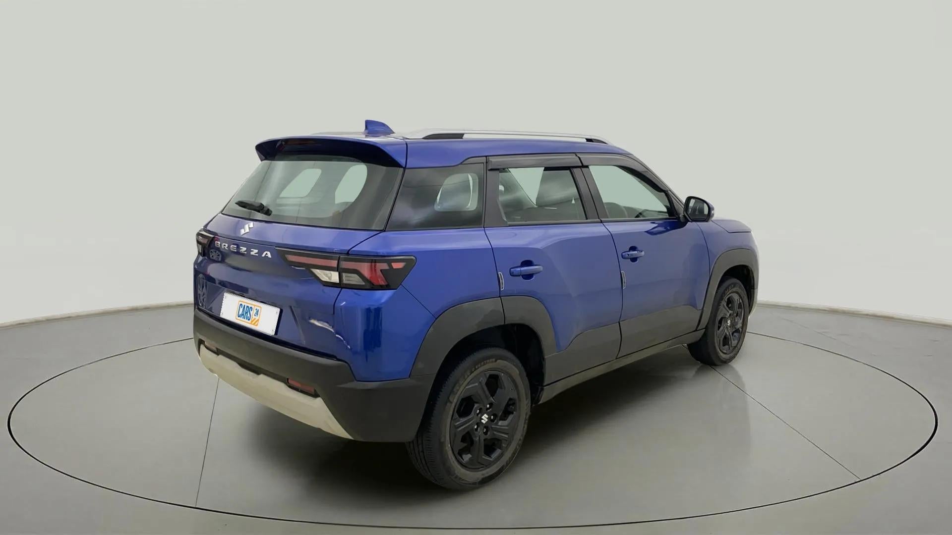 Rear three-quarter view of a exuberant blue Maruti Suzuki Brezza