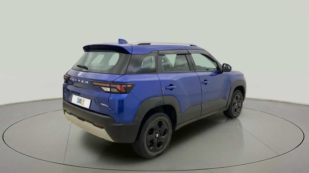 Rear three-quarter view of a exuberant blue Maruti Suzuki Brezza