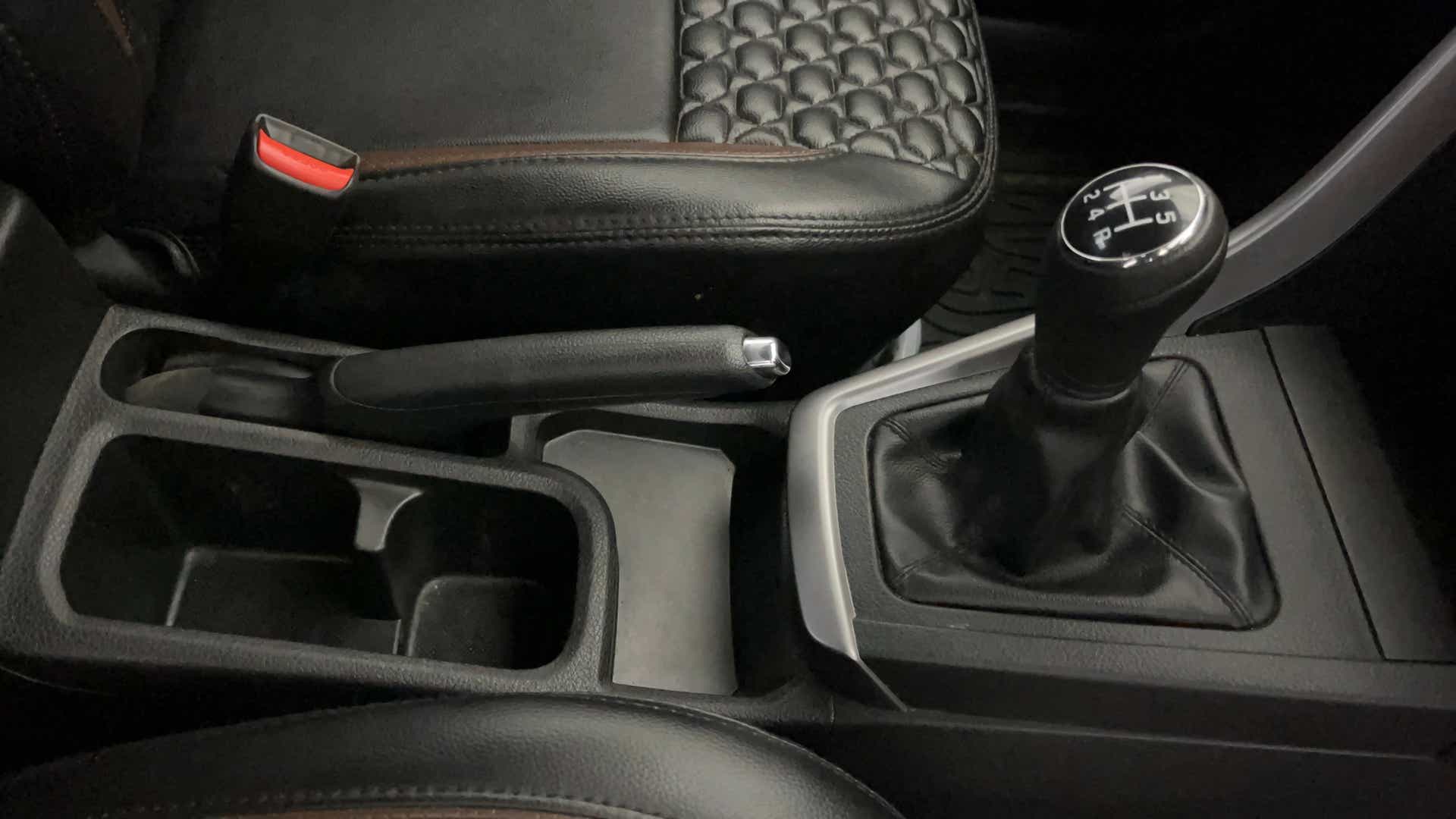 Center console and gear shifter of a Maruti Suzuki Brezza