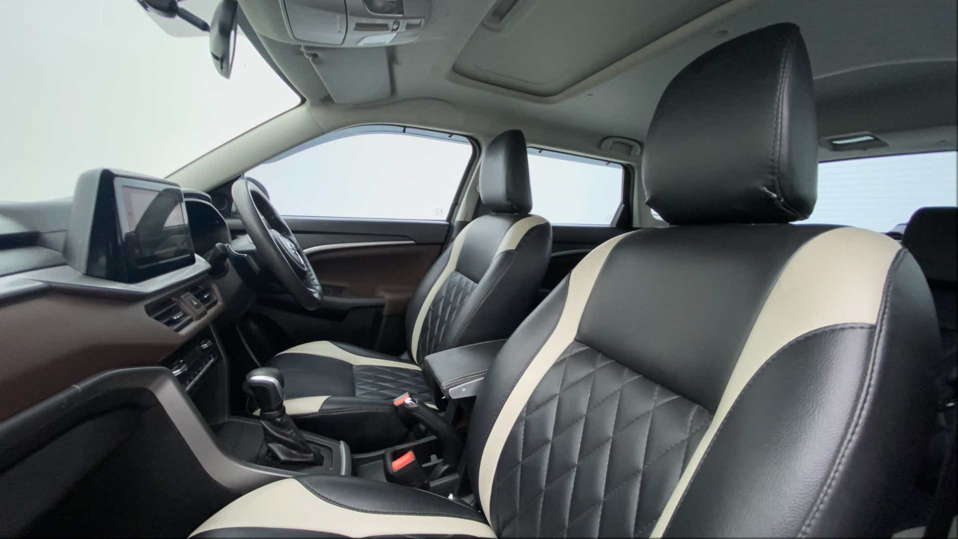 Interior dashboard and front seats of a Maruti Suzuki Brezza