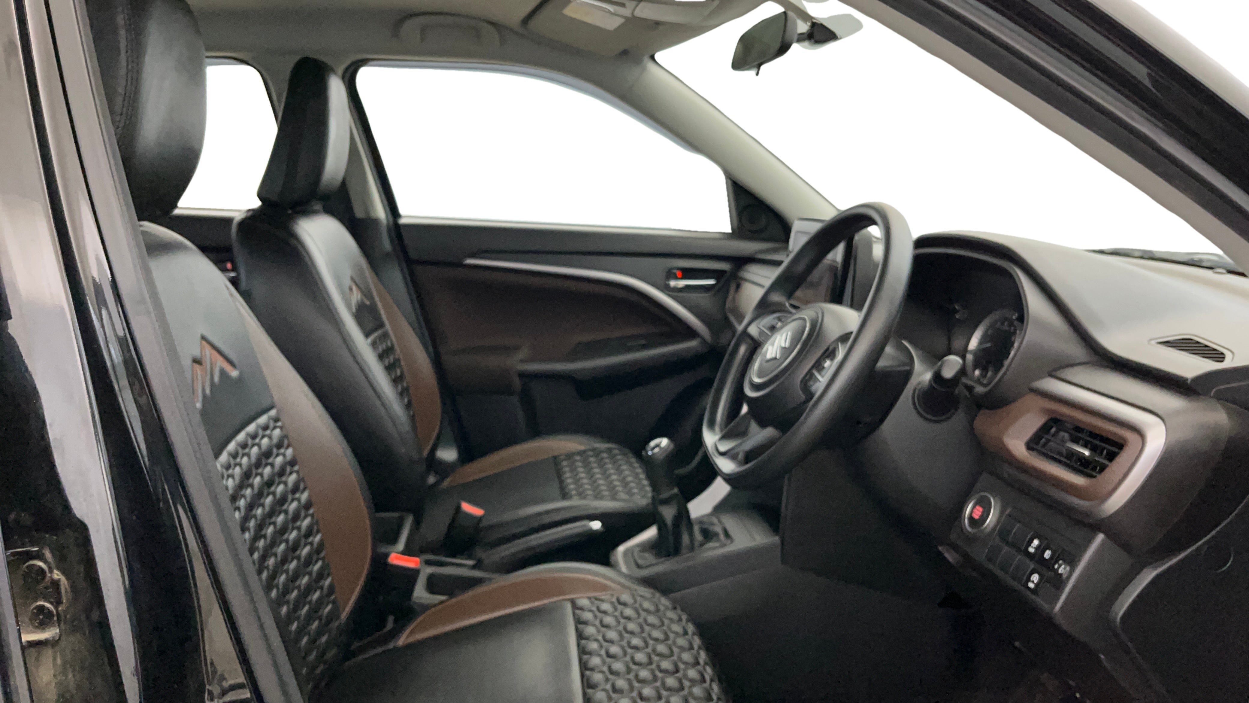 Interior front seats and dashboard of a Maruti Suzuki Brezza