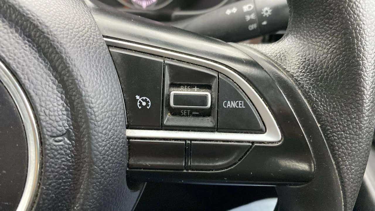 Steering wheel cruise control buttons of a Maruti Suzuki Brezza