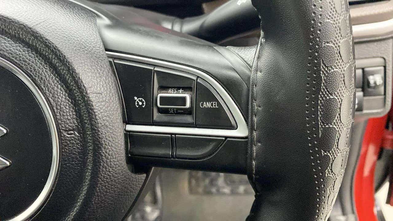 Steering wheel control close-up of a Maruti Suzuki Brezza