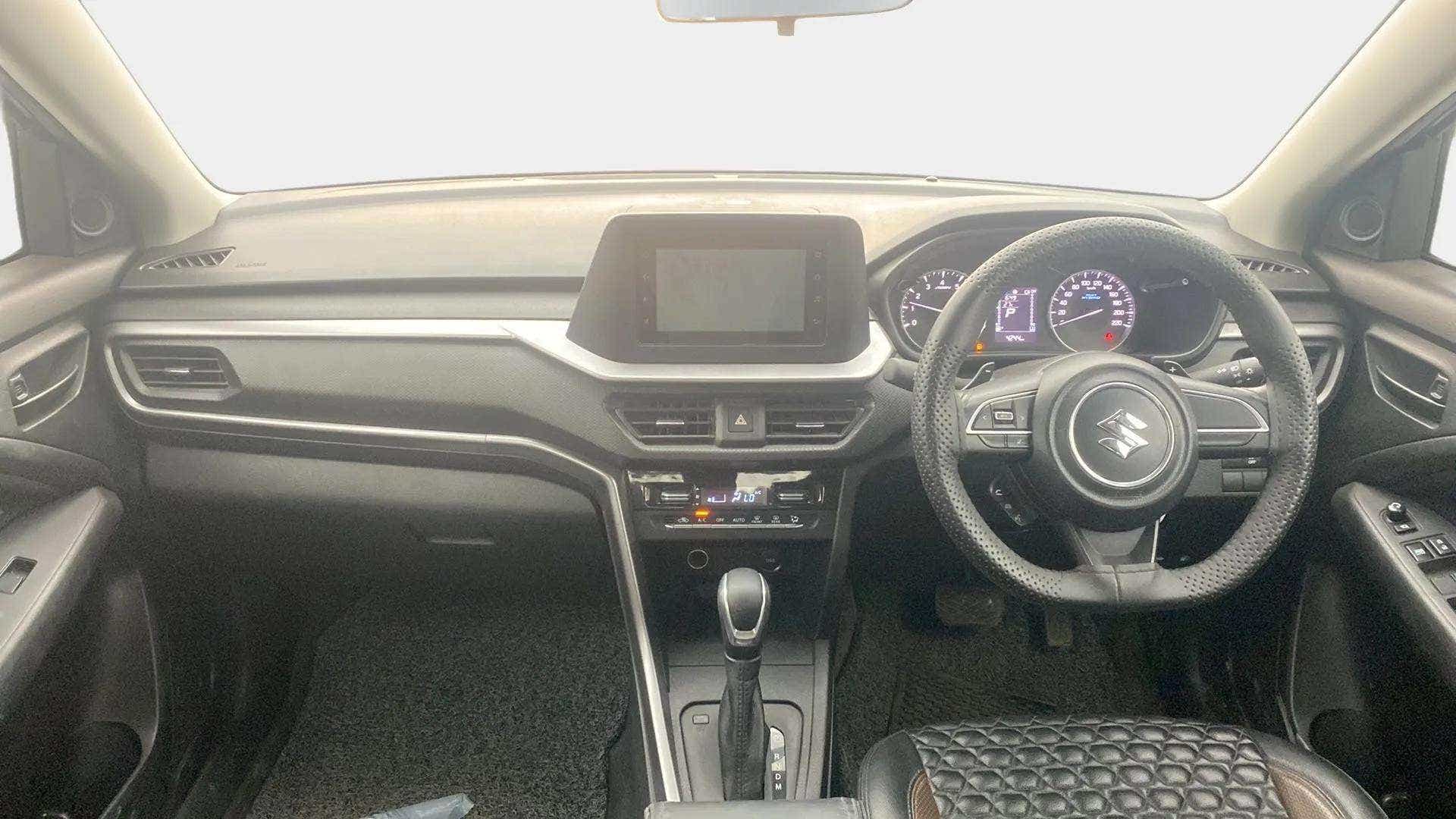 Dashboard and steering wheel view of a Maruti Suzuki Brezza
