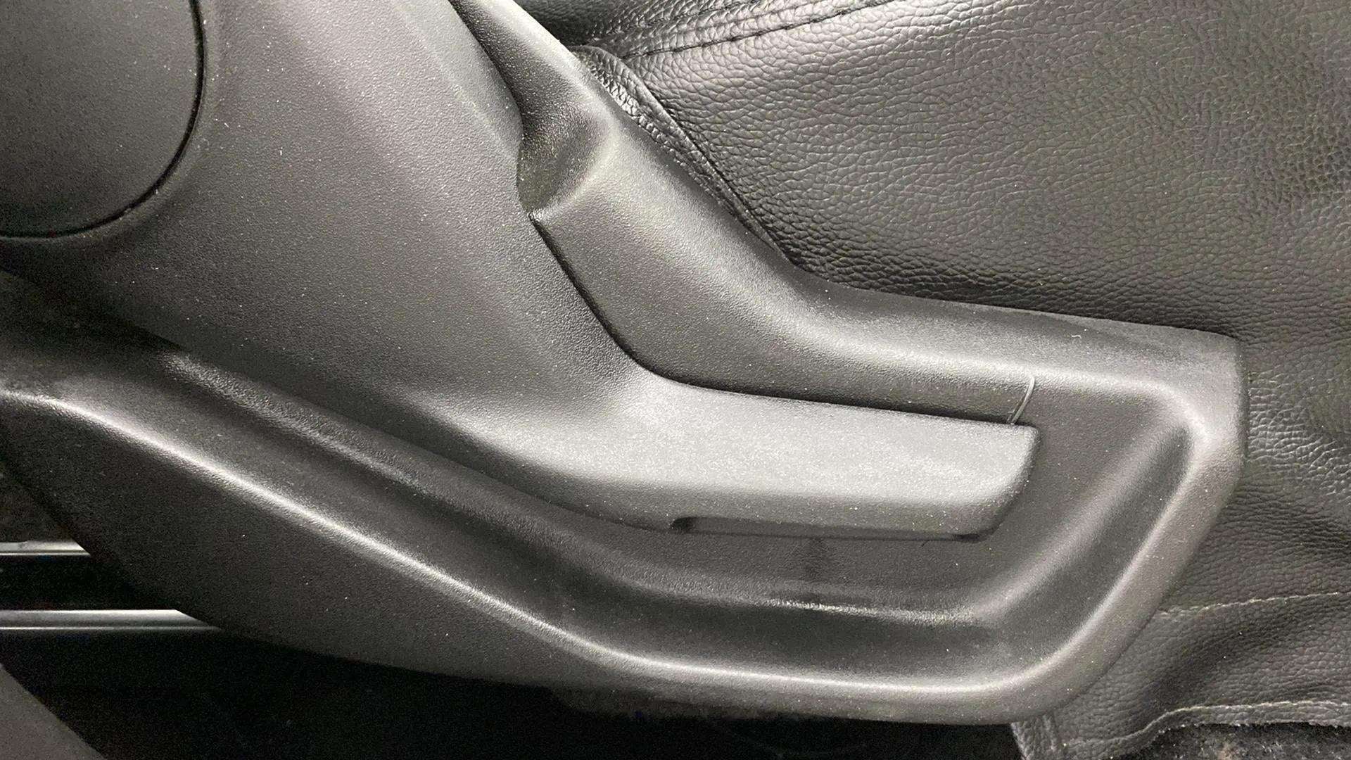 Close-up of a seat adjustment lever in a Maruti Suzuki Brezza