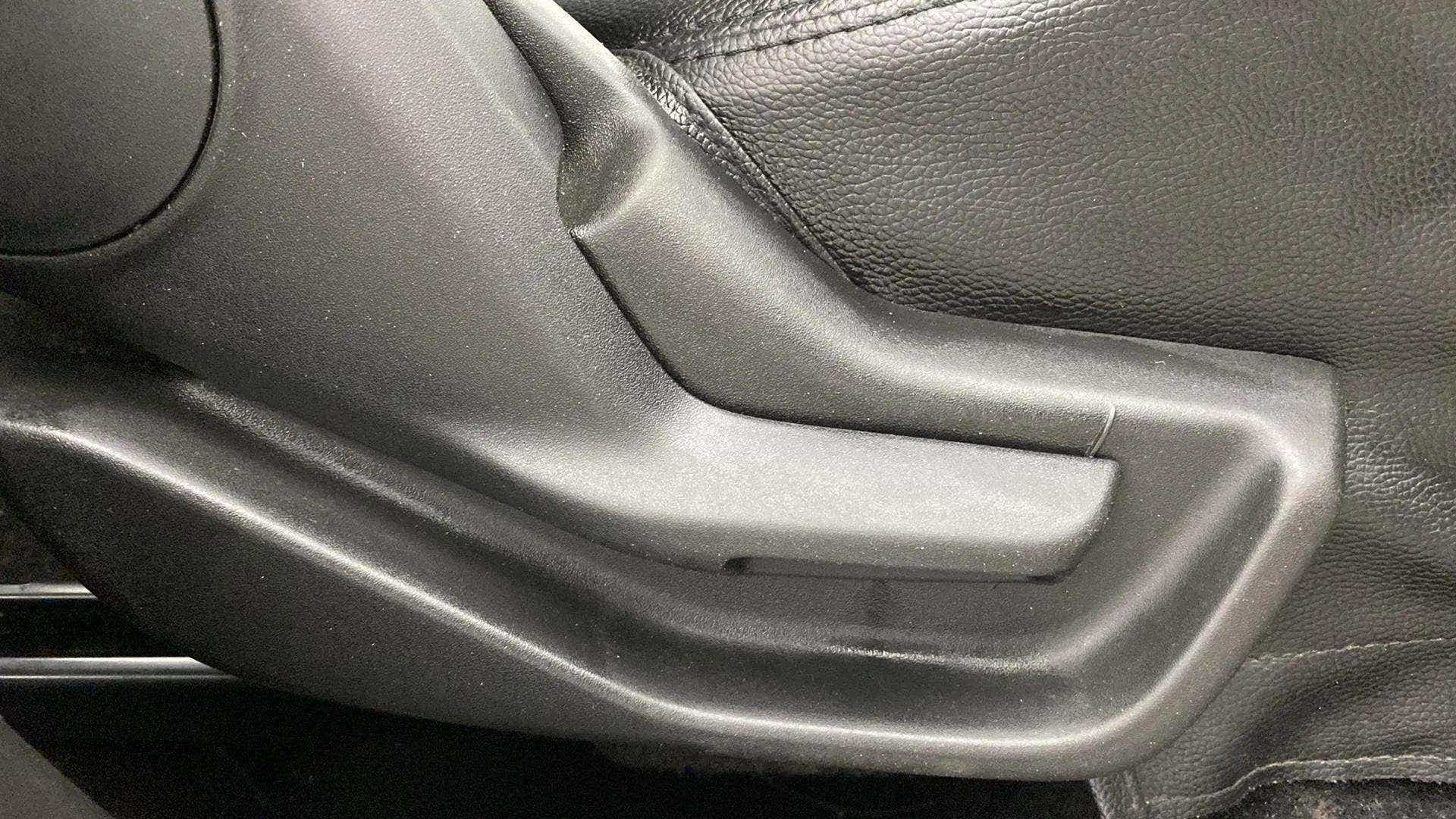 Close-up of a seat adjustment lever in a Maruti Suzuki Brezza