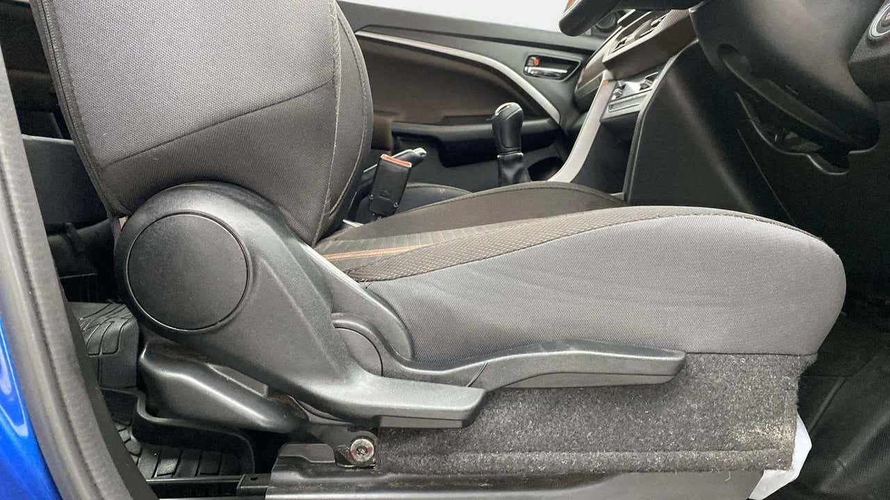 Front seat adjustment lever area of a Maruti Suzuki Brezza