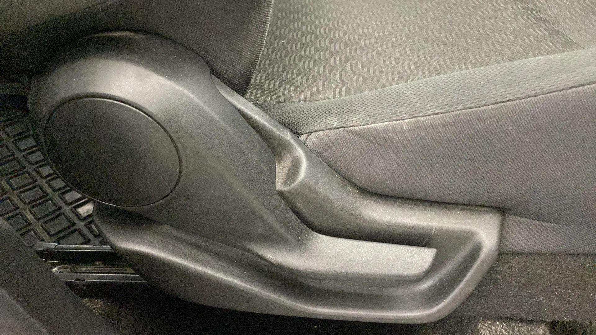 Seat height adjustment lever of a Maruti Suzuki Brezza