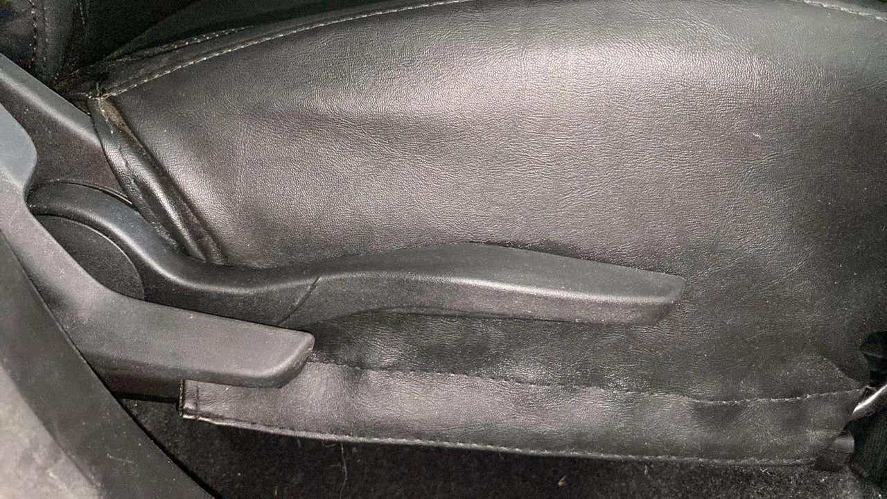 Seat height adjustment lever of a Maruti Suzuki Brezza