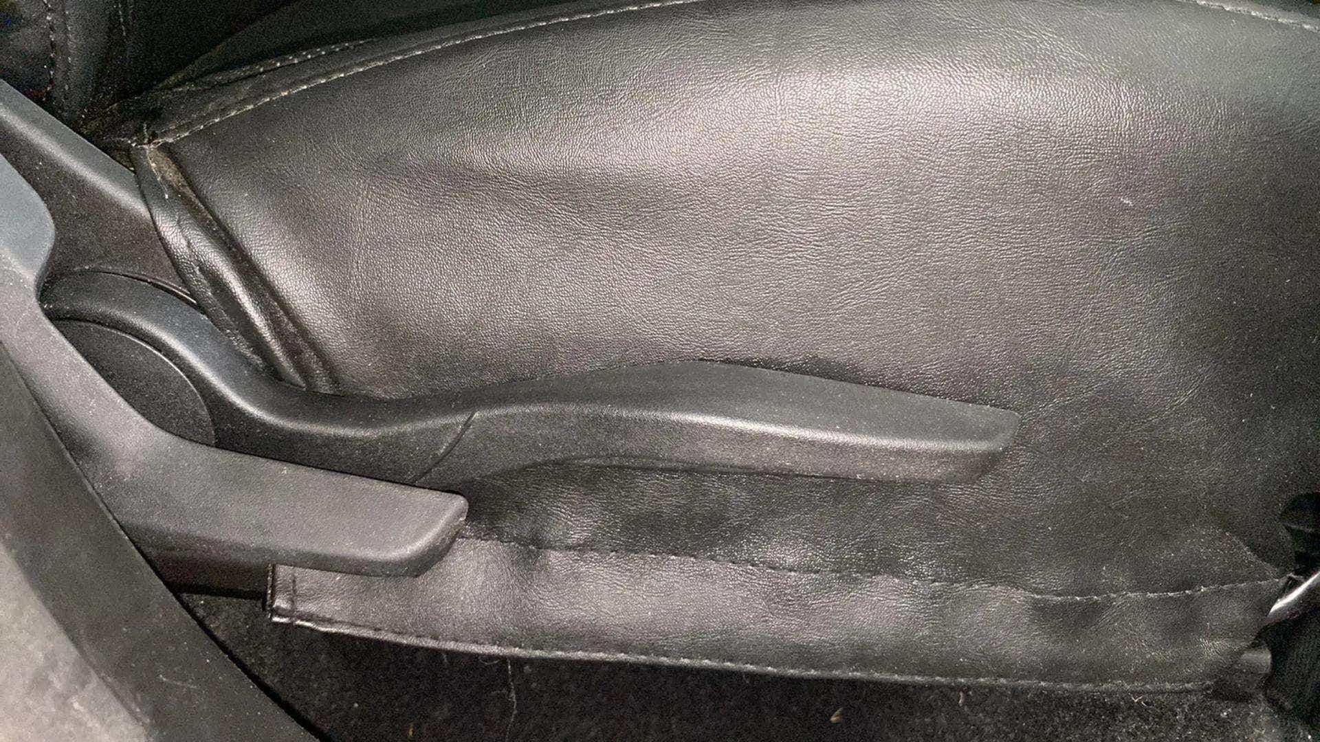 Seat height adjustment lever of a Maruti Suzuki Brezza