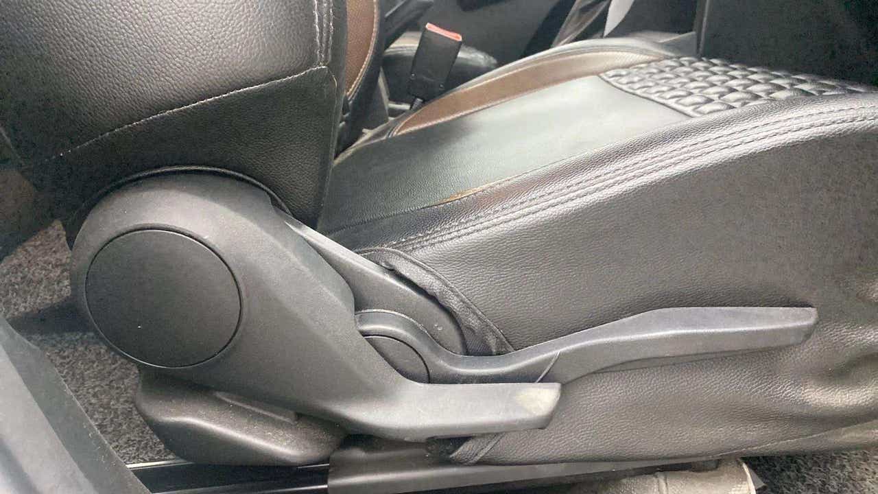 Driver seat adjustment lever of a Maruti Suzuki Brezza