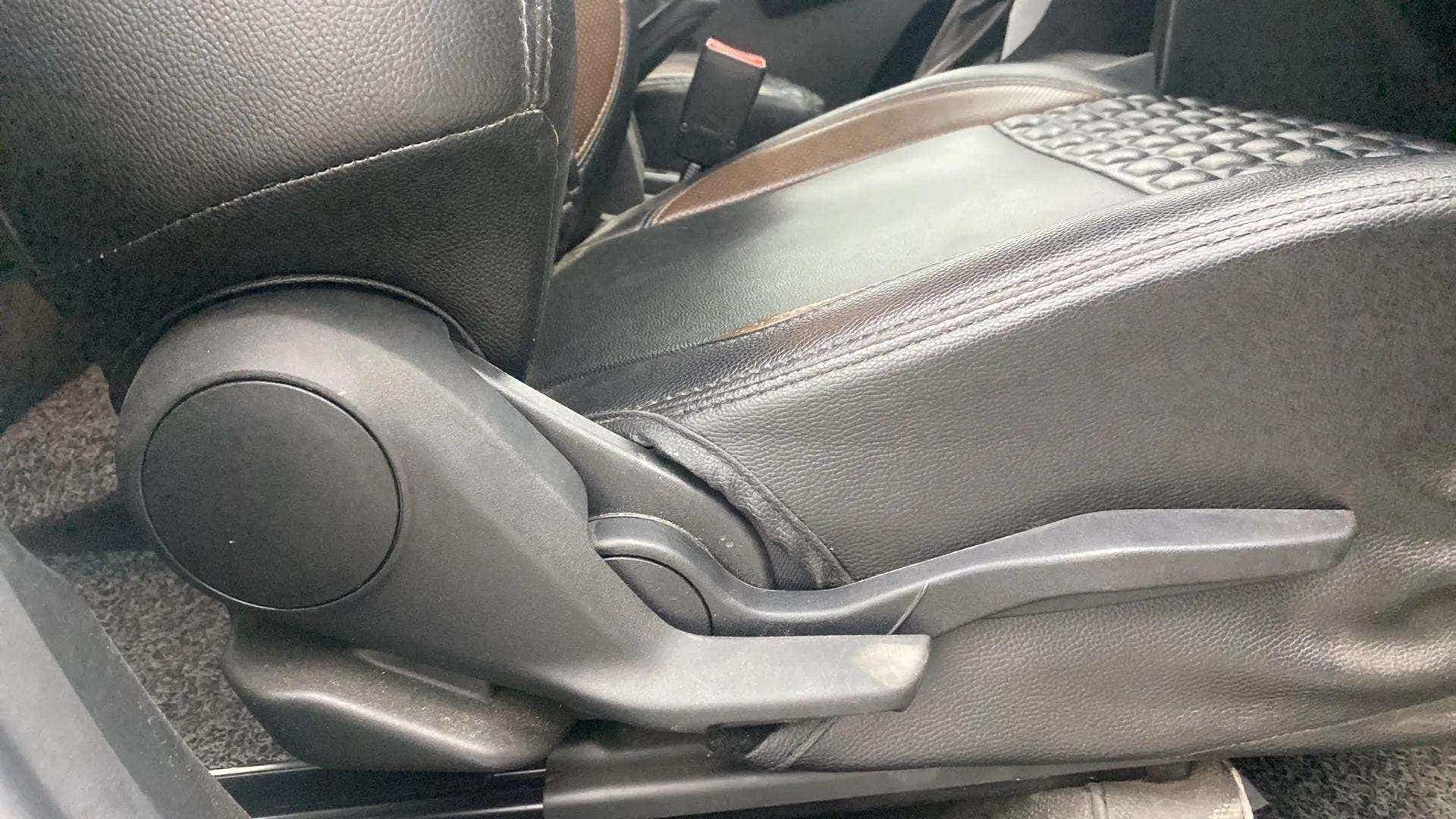 Driver seat adjustment lever of a Maruti Suzuki Brezza