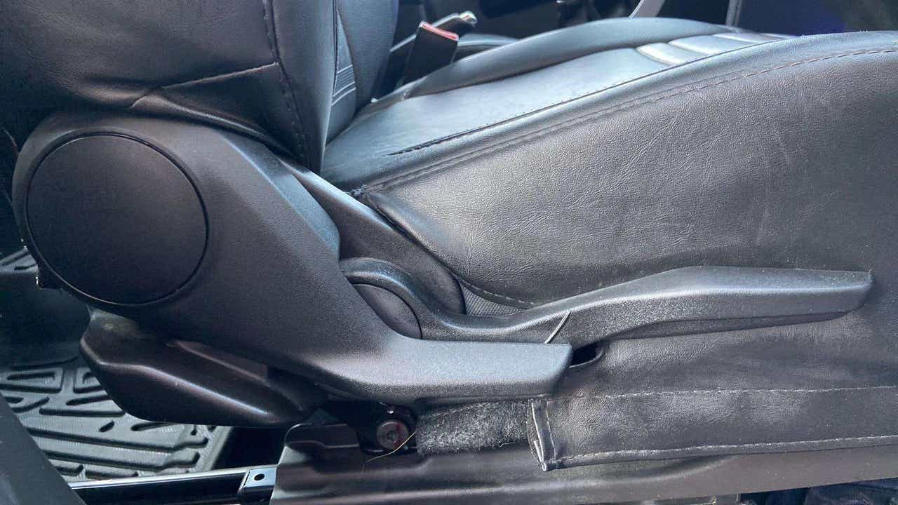 Side view of a Maruti Suzuki Brezza car seat adjustment lever