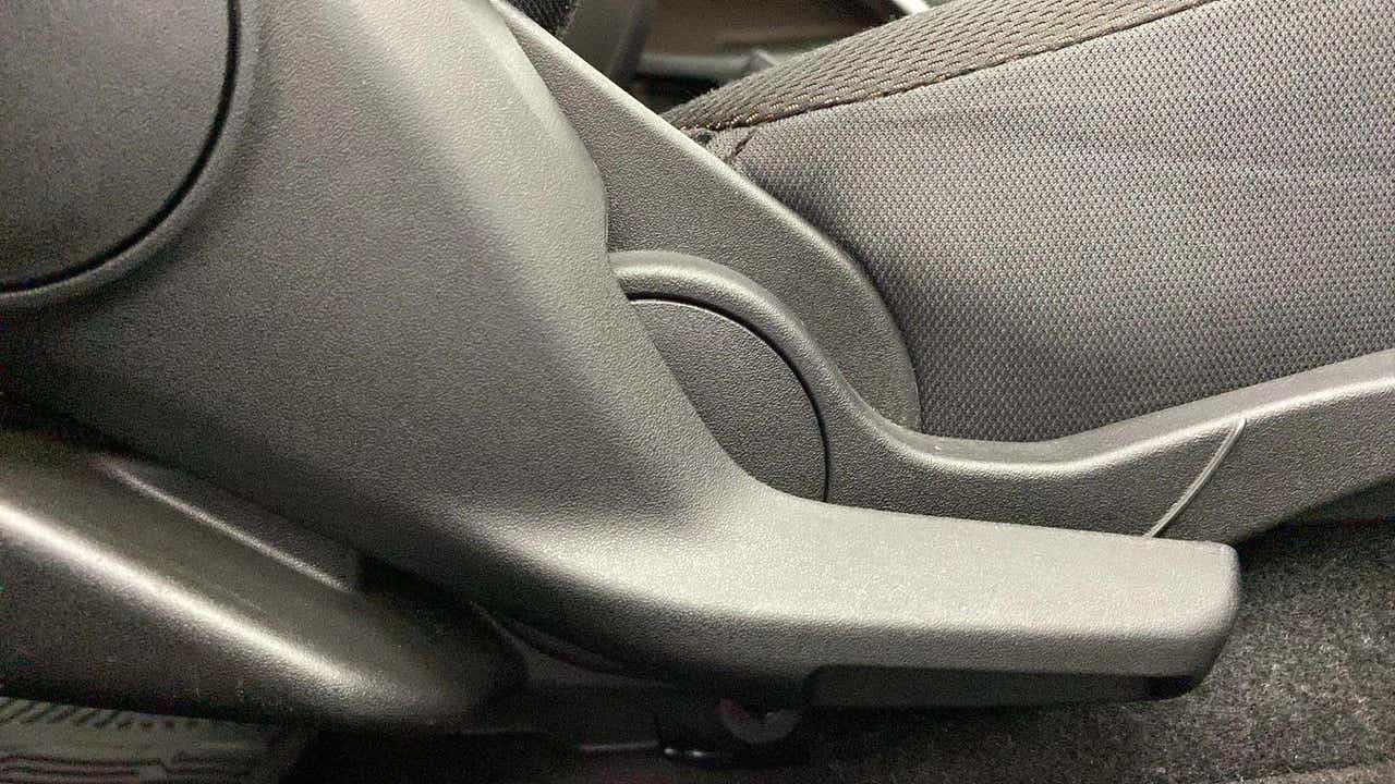 Seat adjustment lever close-up of a Maruti Suzuki Brezza