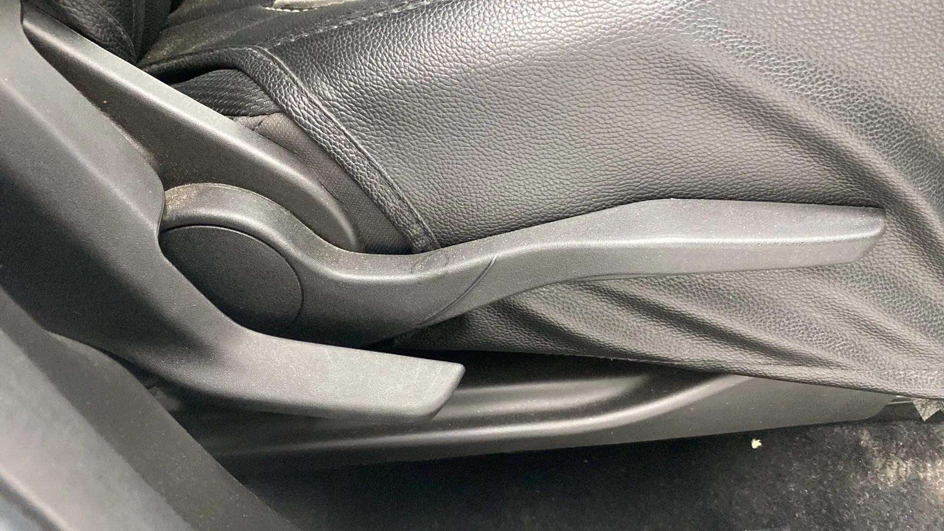Seat adjustment handle of a Maruti Suzuki Brezza