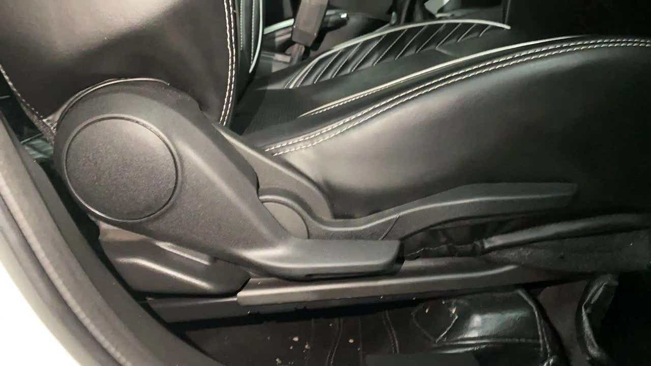 Manual seat adjustment lever close-up of a Maruti Suzuki Brezza