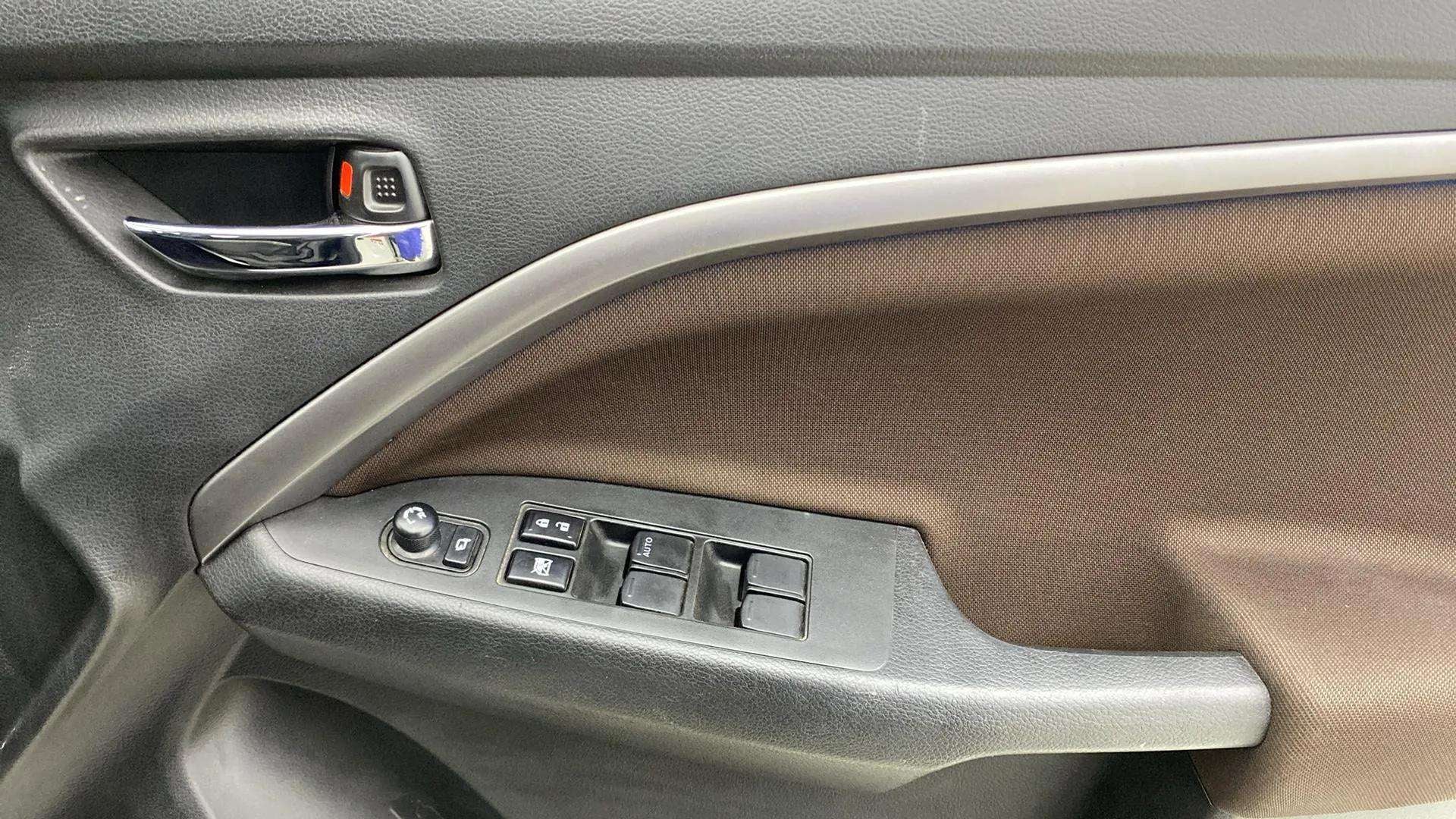 Driver side door controls of a Maruti Suzuki Brezza