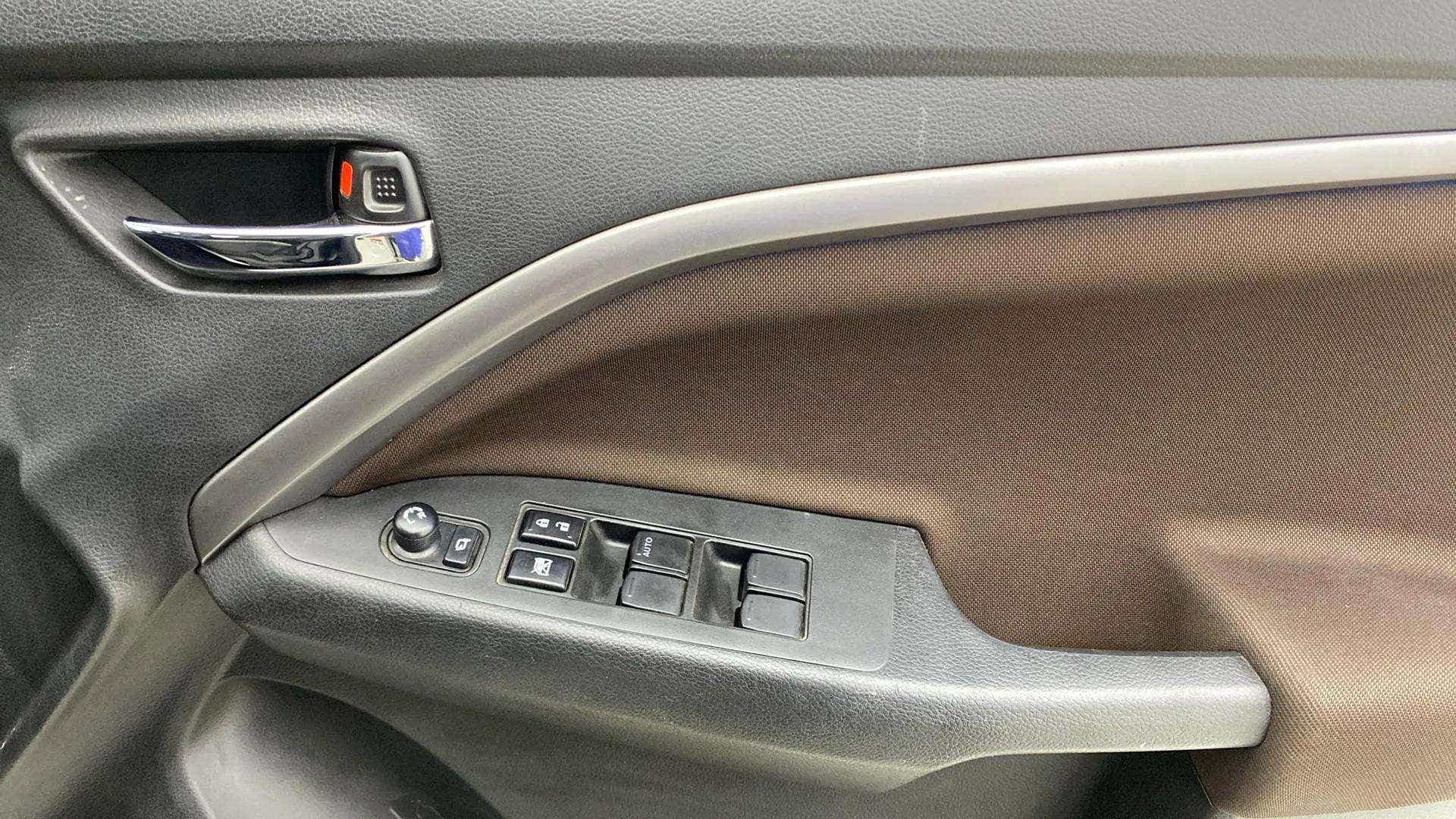 Driver side door controls of a Maruti Suzuki Brezza