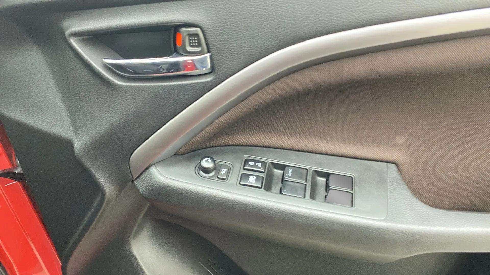 Driver-side door controls of a Maruti Suzuki Brezza